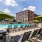 a pool with chairs and umbrellas
