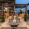 a patio with tables and chairs