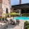 a pool with chairs and umbrellas
